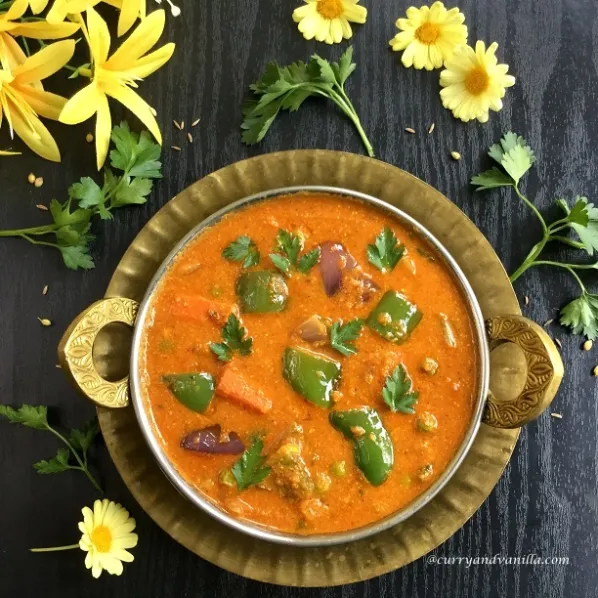 A variety of Indian gravies like paneer butter masala, dal, and mixed veg curry served in bowls